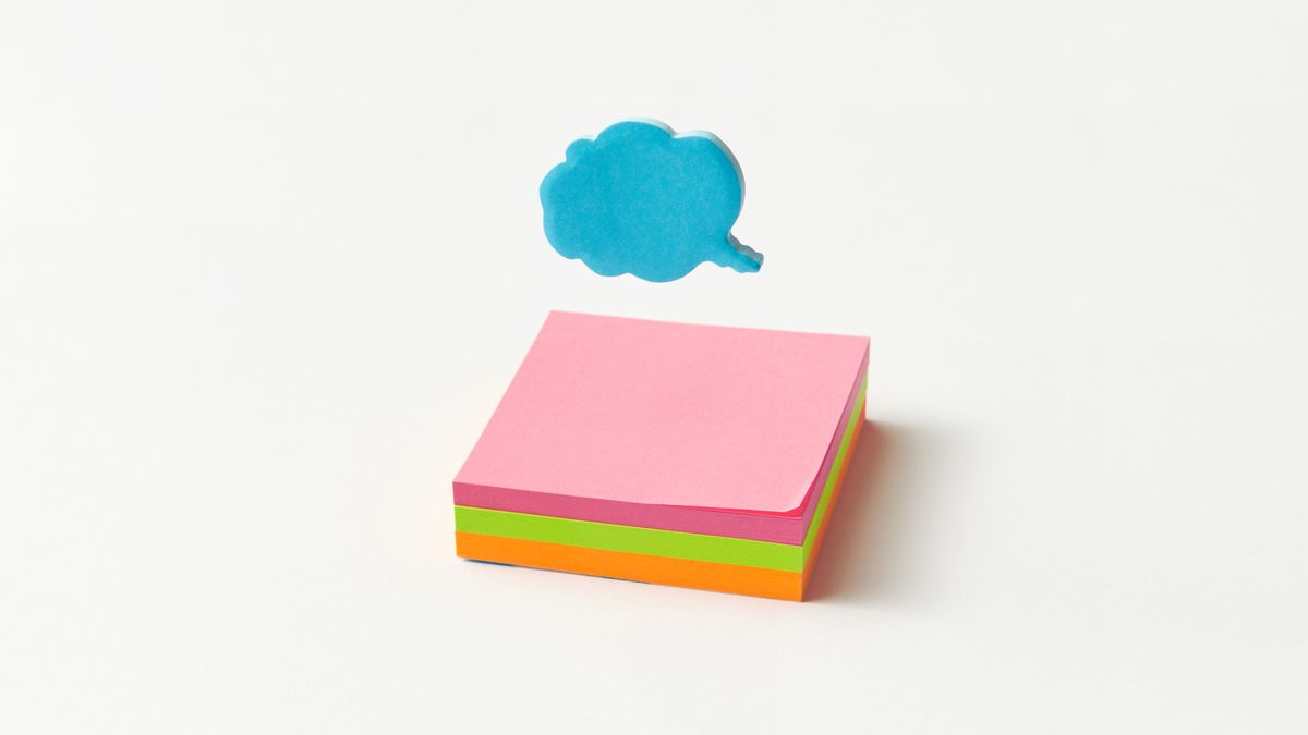 Vibrant stack of sticky notes with a blue cloud-shaped speech bubble on a white background.